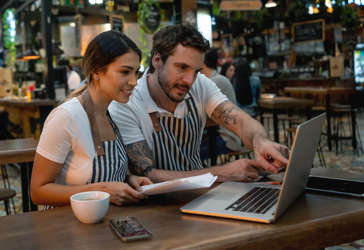 Staff working at a restaurant managing the finances